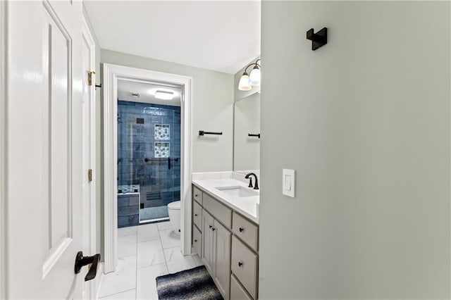 bathroom featuring vanity, toilet, and walk in shower