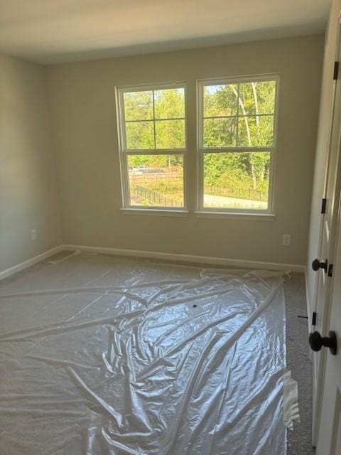 unfurnished room featuring a wealth of natural light