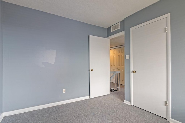 unfurnished bedroom with carpet flooring