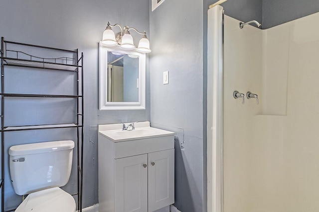 bathroom with vanity, toilet, and a shower with shower curtain