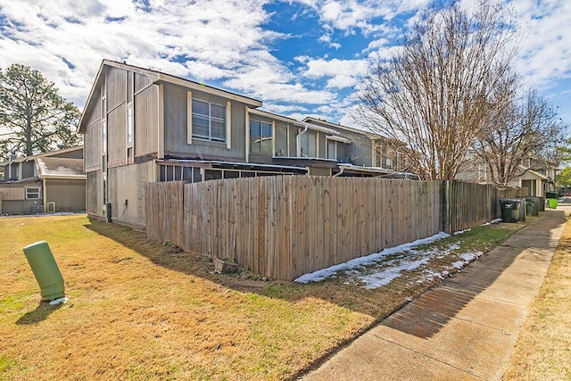 view of property exterior with a yard