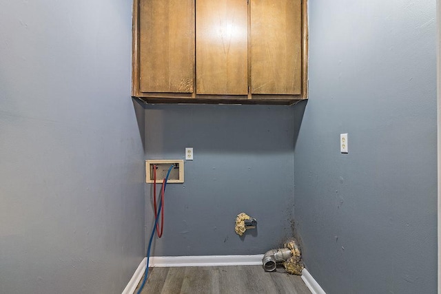 laundry room featuring cabinets, hookup for a washing machine, and hardwood / wood-style floors