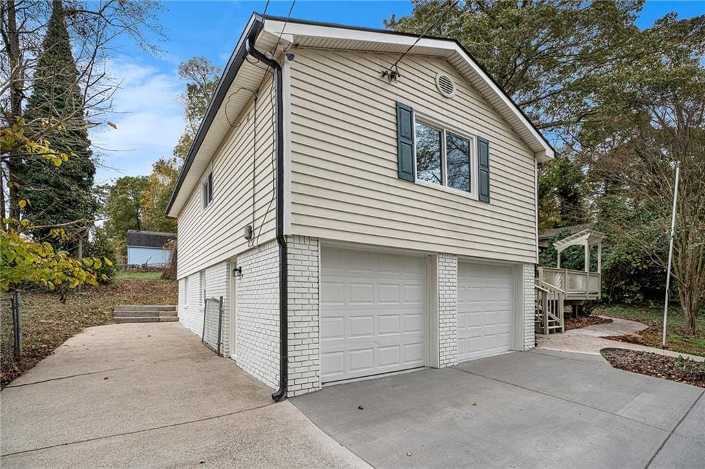 view of side of property featuring a garage