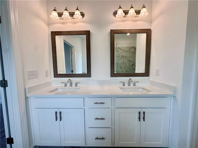 bathroom featuring double vanity, a shower, and a sink