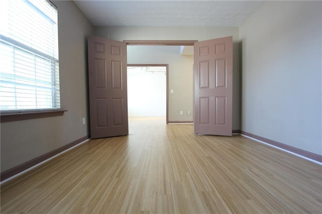 838 Roxholly Ln, Buford, GA 30518 - empty room featuring light wood-type flooring and baseboards