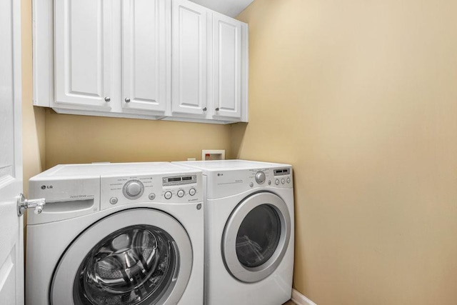 laundry area featuring cabinet space and washer and dryer