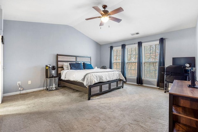 bedroom featuring ceiling fan, lofted ceiling, and light carpet