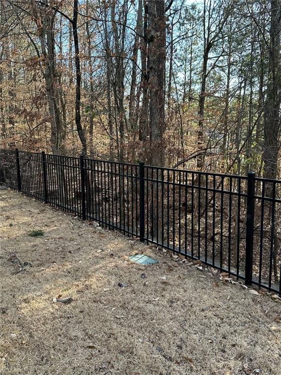 view of gate with fence