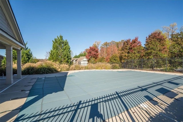 view of pool featuring a patio area, fence, and a fenced in pool