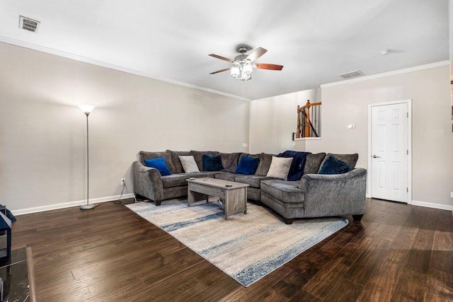 living room featuring dark wood-type flooring, ceiling fan, and ornamental molding