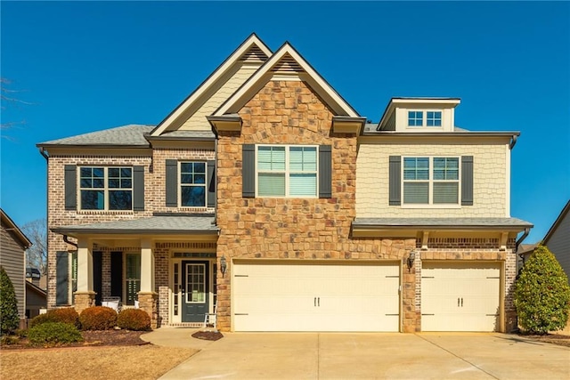 craftsman house with a garage and covered porch