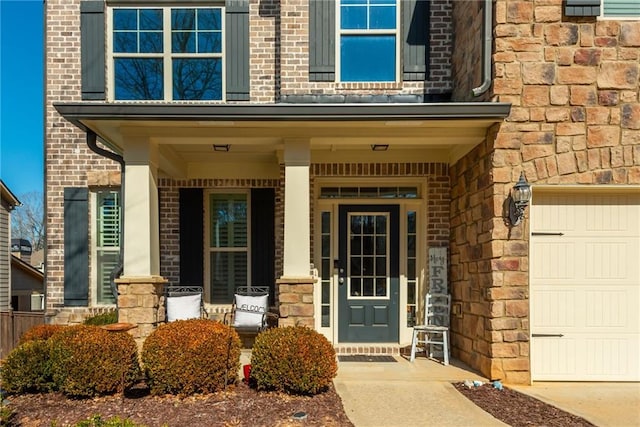 entrance to property with a porch and a garage