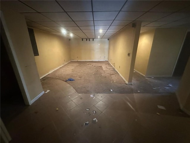 finished basement featuring a drop ceiling