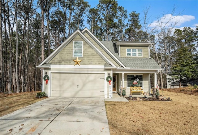 craftsman inspired home featuring covered porch and a front lawn