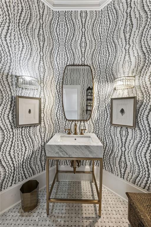 bathroom with baseboards and a sink