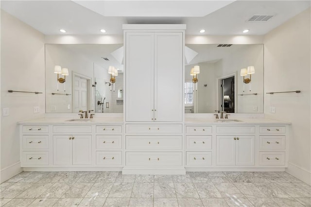 bathroom featuring visible vents, a stall shower, vanity, and lofted ceiling