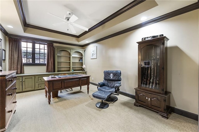 playroom with a tray ceiling, light colored carpet, baseboards, and ornamental molding