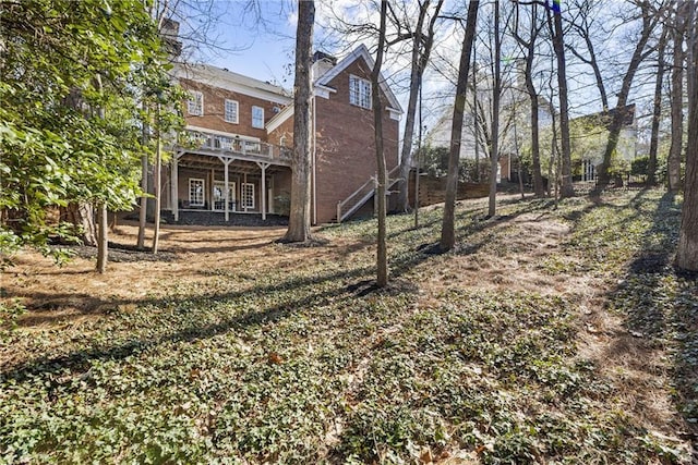 view of yard featuring a wooden deck