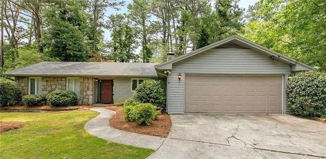 ranch-style house with a front yard and a garage