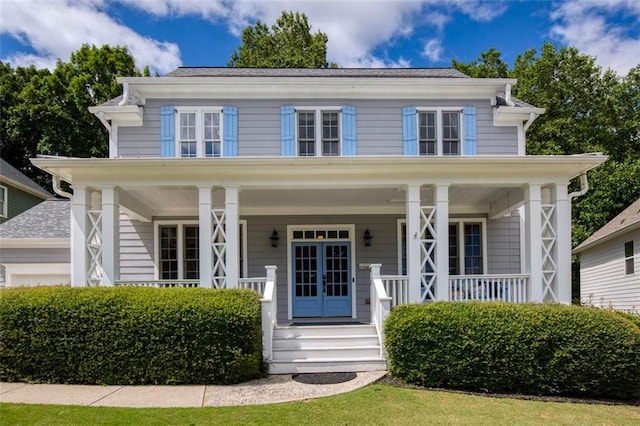 view of front of house featuring french doors and covered porch