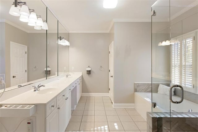 full bathroom featuring tile patterned flooring, ornamental molding, a garden tub, and a sink