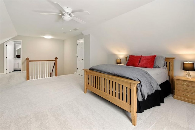 bedroom with light carpet, lofted ceiling, and a ceiling fan