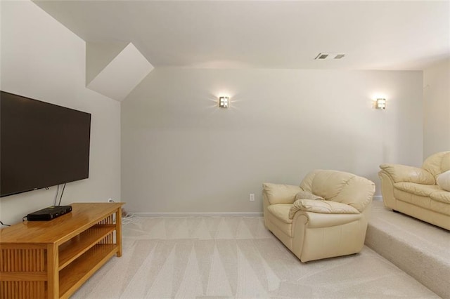 living room featuring visible vents, baseboards, and light colored carpet