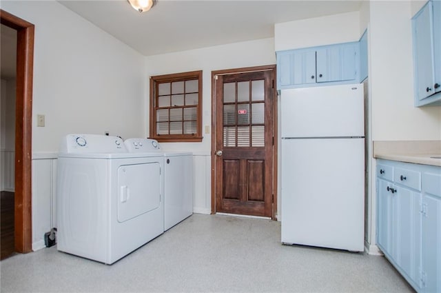 washroom with cabinets and separate washer and dryer