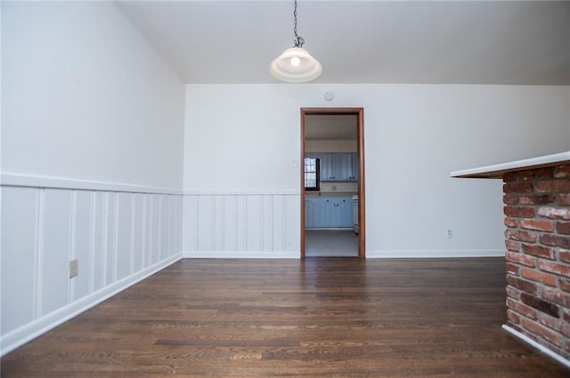 unfurnished living room with dark hardwood / wood-style floors