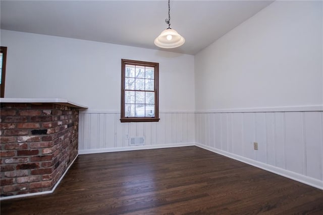 unfurnished living room featuring dark hardwood / wood-style flooring