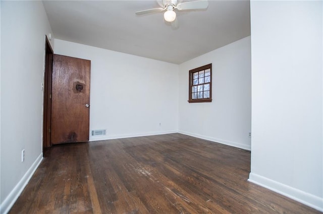 empty room with dark wood-type flooring and ceiling fan