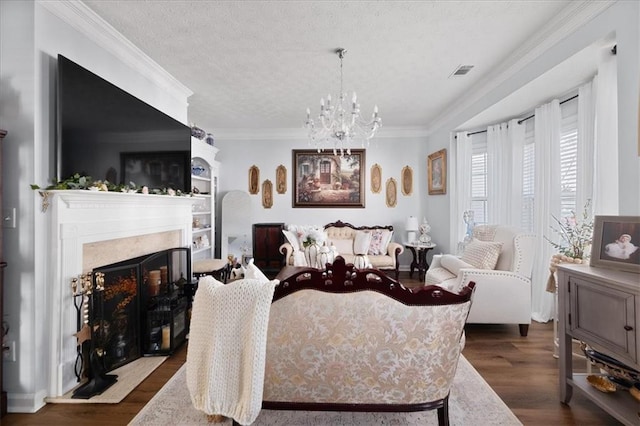 living area with dark wood-style floors, a premium fireplace, visible vents, and crown molding