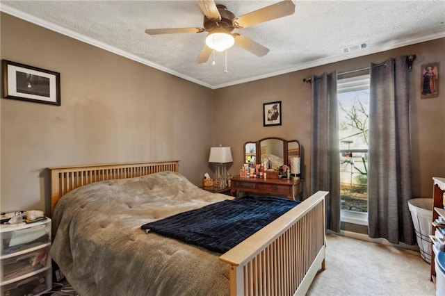 carpeted bedroom with crown molding, ceiling fan, and a textured ceiling