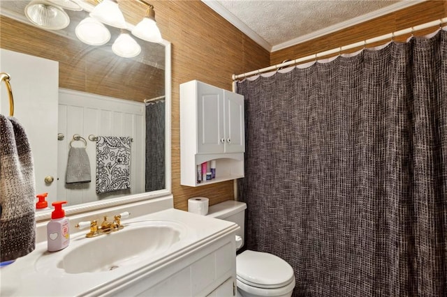 bathroom with vanity, ornamental molding, a textured ceiling, curtained shower, and toilet