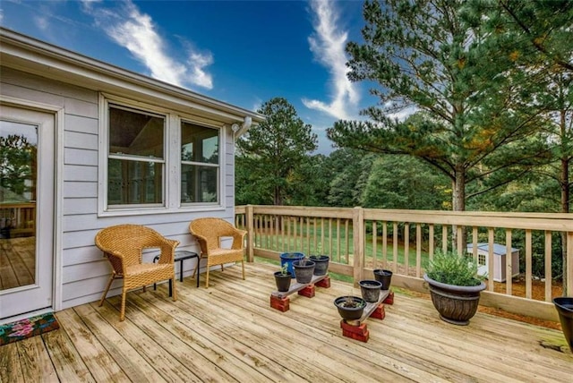 wooden terrace featuring central air condition unit