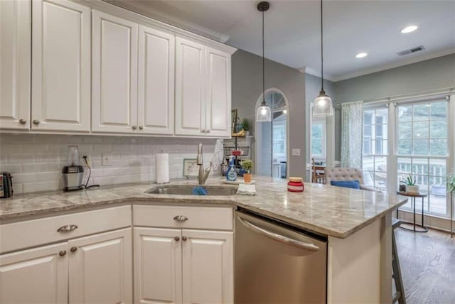 kitchen with white cabinets, crown molding, dishwasher, and light hardwood / wood-style flooring