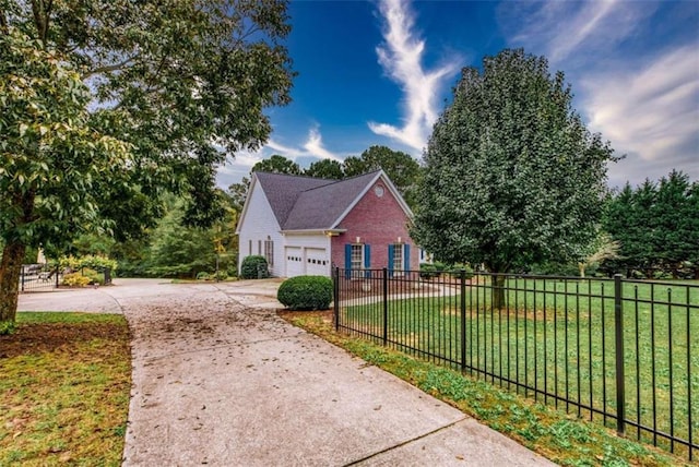 view of side of home featuring a lawn and a garage