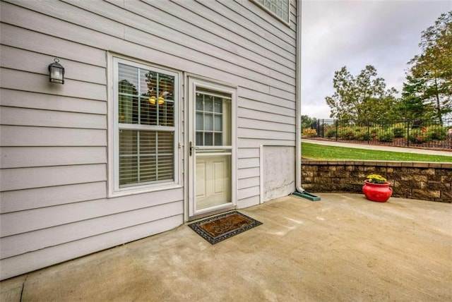 entrance to property featuring a patio