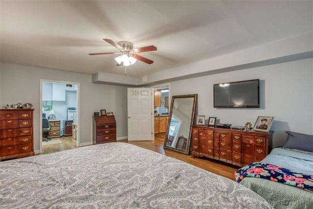 bedroom with light hardwood / wood-style flooring and ceiling fan