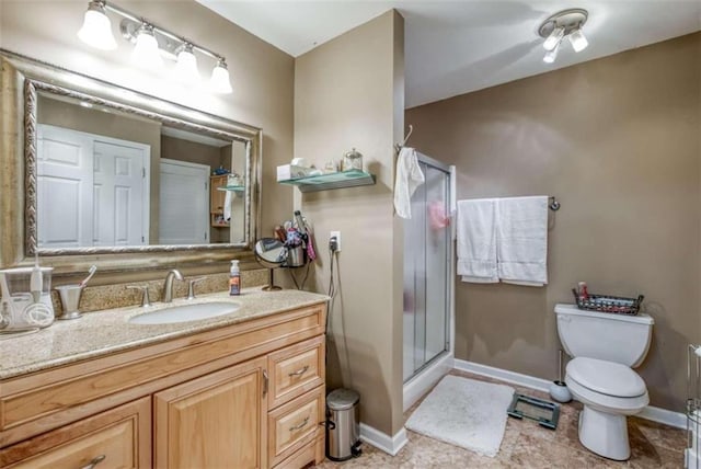 bathroom with a shower with shower door, toilet, tile flooring, and vanity