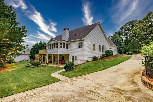 rear view of property with a yard