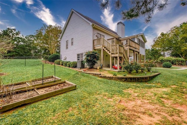 exterior space featuring a lawn and a deck