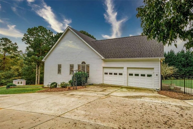 view of side of property featuring a garage