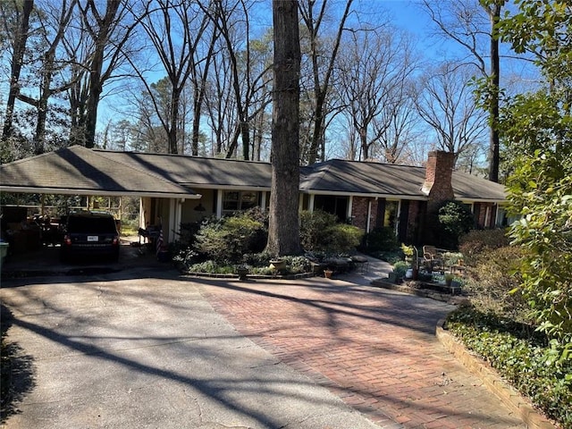 single story home with a carport