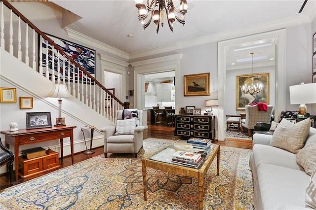 living room featuring a chandelier, crown molding, and dark hardwood / wood-style flooring