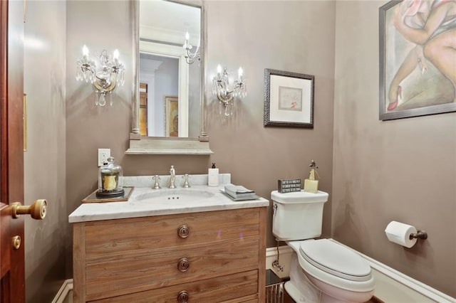 bathroom with toilet and vanity