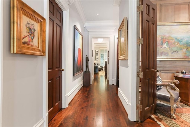 hallway featuring ornamental molding and dark hardwood / wood-style floors