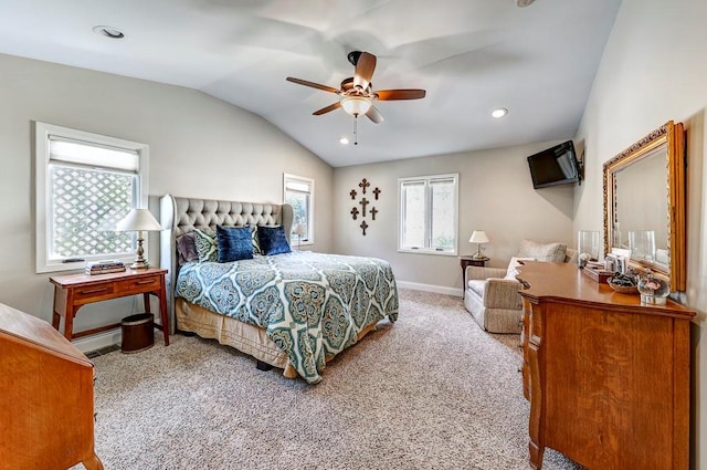 bedroom with ceiling fan, light carpet, and vaulted ceiling