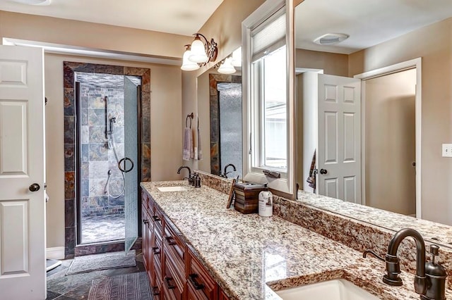 bathroom with double vanity, a tile shower, and tile floors