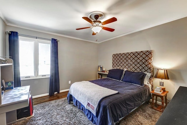 bedroom with ceiling fan, crown molding, and dark wood-type flooring